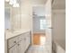 This bathroom features a tiled floor and shower with a double vanity at 5085 Hampton Bluff Ct, Roswell, GA 30075