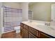 Bathroom with double vanity, sleek countertops, modern fixtures, and a stylish shower curtain at 104 Camilla Dr, Carrollton, GA 30116