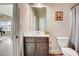 Bathroom with white vanity, large mirror, and neutral wall color at 104 Camilla Dr, Carrollton, GA 30116