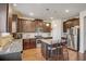 Modern kitchen with granite countertops, a stainless steel refrigerator, and wood floors at 104 Camilla Dr, Carrollton, GA 30116