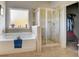 The main bathroom showcases a bathtub, tiled shower, and walk-in closet at 104 Camilla Dr, Carrollton, GA 30116