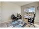 Office area with a large window and a blue and grey geometric rug at 104 Camilla Dr, Carrollton, GA 30116