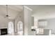 Bright kitchen with white cabinets and appliances, light gray walls, and wood-look floors at 690 Park Place Way, Social Circle, GA 30025