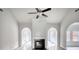 Open living room featuring fireplace, arches, and wood-look floors at 690 Park Place Way, Social Circle, GA 30025