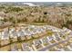Picturesque aerial view of a well-planned residential neighborhood, lush greenery, and a scenic lake in the background at 224 Shoals Bridge Rd, Acworth, GA 30102