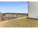 Spacious backyard featuring a fenced yard, grassy area, and landscape, providing privacy and room to play at 224 Shoals Bridge Rd, Acworth, GA 30102