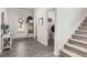Bright entryway with coat rack, staircase, and convenient access to the laundry room at 224 Shoals Bridge Rd, Acworth, GA 30102