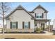 Charming two-story home with gray siding, brick accents, and a well-maintained front yard at 224 Shoals Bridge Rd, Acworth, GA 30102