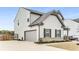 Charming two-story home with a well-maintained lawn, garage, and appealing curb appeal in a suburban setting at 224 Shoals Bridge Rd, Acworth, GA 30102