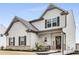 Charming two-story home with gray siding, brick accents, and a covered front porch at 224 Shoals Bridge Rd, Acworth, GA 30102