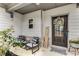 Cozy front porch features a welcoming wreath, seating, and stylish decor at 224 Shoals Bridge Rd, Acworth, GA 30102