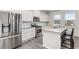 Bright kitchen with stainless steel appliances, granite countertops, and modern white cabinets at 224 Shoals Bridge Rd, Acworth, GA 30102