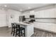 Modern kitchen with white cabinets, stainless steel appliances, and a granite-top island with seating at 224 Shoals Bridge Rd, Acworth, GA 30102