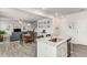Open-concept living and dining area featuring modern grey flooring and a granite-top island at 224 Shoals Bridge Rd, Acworth, GA 30102