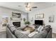 Cozy living room with a fireplace, comfortable seating, and natural light at 224 Shoals Bridge Rd, Acworth, GA 30102