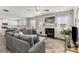 Spacious living room with a fireplace, large windows, and an open layout to the kitchen at 224 Shoals Bridge Rd, Acworth, GA 30102