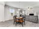 Comfortable living space with a fireplace, gray sofa, and a dining area with bright natural light at 224 Shoals Bridge Rd, Acworth, GA 30102
