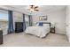 Spacious main bedroom with a tray ceiling, large windows, and ample closet space at 224 Shoals Bridge Rd, Acworth, GA 30102