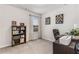 Bright office featuring a dark wood bookshelf and desk near a window with natural light at 224 Shoals Bridge Rd, Acworth, GA 30102