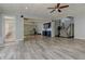 Open basement featuring bar area, stairs, and vinyl floors perfect for entertaining at 8155 Legends View Ct, Cumming, GA 30028