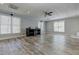 Large open basement area with bright natural light, neutral paint color, and ceiling fans at 8155 Legends View Ct, Cumming, GA 30028
