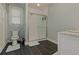 Modern bathroom with walk-in shower, sleek fixtures, and elegant tile flooring at 8155 Legends View Ct, Cumming, GA 30028