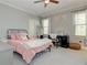 Comfortable bedroom features gray walls, carpet, and natural light from the two windows at 8155 Legends View Ct, Cumming, GA 30028