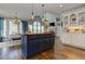 Open concept dining and kitchen area with hardwood floors and natural light at 8155 Legends View Ct, Cumming, GA 30028