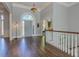 Spacious foyer with hardwood floors, high ceilings, and elegant decor, offering a grand entrance to the home at 8155 Legends View Ct, Cumming, GA 30028