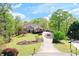 Beautiful front yard with lush green landscaping and inviting curb appeal at 8155 Legends View Ct, Cumming, GA 30028