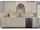 Kitchen with white cabinets, marble countertop, and stainless steel dishwasher at 8155 Legends View Ct, Cumming, GA 30028