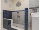 This well-lit laundry room includes a dog wash station, tile flooring, and a washer at 8155 Legends View Ct, Cumming, GA 30028