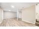 A spacious basement with light, neutral colored walls and wood-look flooring at 869 Capitol View Nw Ave, Atlanta, GA 30318