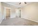 Spacious bedroom with ceiling fan, carpeted floors, with closet and bath access at 869 Capitol View Nw Ave, Atlanta, GA 30318