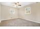 Cozy bedroom with neutral paint, plush carpet, and ample natural light from two windows at 869 Capitol View Nw Ave, Atlanta, GA 30318