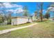 Side view of a well-kept home with a landscaped yard, painted exterior, and updated walkway at 869 Capitol View Nw Ave, Atlanta, GA 30318