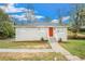 Charming single-story home with a freshly painted exterior, red door, and well-maintained front yard at 869 Capitol View Nw Ave, Atlanta, GA 30318