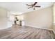 Open concept living space with updated flooring and a view into the adjacent kitchen and dining area at 869 Capitol View Nw Ave, Atlanta, GA 30318