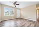 Bright living room featuring new flooring, fresh paint, ceiling fan, and plenty of natural light at 869 Capitol View Nw Ave, Atlanta, GA 30318