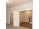 Bedroom with open doors to closet and hall, carpeted floor, and plenty of light at 161 Basil St, Cumming, GA 30040
