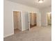 Spacious bedroom with carpeted floor, and access to bathroom and walk-in closet at 161 Basil St, Cumming, GA 30040