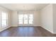 Elegant dining room with ample natural light, chandelier, and hardwood flooring at 161 Basil St, Cumming, GA 30040