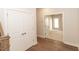 Inviting entryway with hardwood floors and convenient closet space, leading to various rooms in the home at 161 Basil St, Cumming, GA 30040