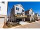 Modern home with a wooden deck, garage, and fenced yard at 161 Basil St, Cumming, GA 30040