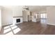 Inviting living room with hardwood floors, a fireplace, and plenty of natural light at 161 Basil St, Cumming, GA 30040