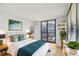 Bright bedroom with a large window, balcony access, and stylish decor provides a relaxing space at 3481 Lakeside Ne Dr # 807, Atlanta, GA 30326