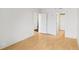 Image of an empty room with wood floor, white walls, and two white doors at 3481 Lakeside Ne Dr # 807, Atlanta, GA 30326
