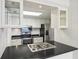 Kitchen with stainless steel appliances, bright white cabinets, and a black countertop at 3481 Lakeside Ne Dr # 807, Atlanta, GA 30326