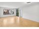 Spacious living room featuring hardwood floors and a large window with a balcony at 3481 Lakeside Ne Dr # 807, Atlanta, GA 30326
