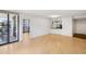 Bright living room with hardwood floors and large glass doors to a balcony at 3481 Lakeside Ne Dr # 807, Atlanta, GA 30326